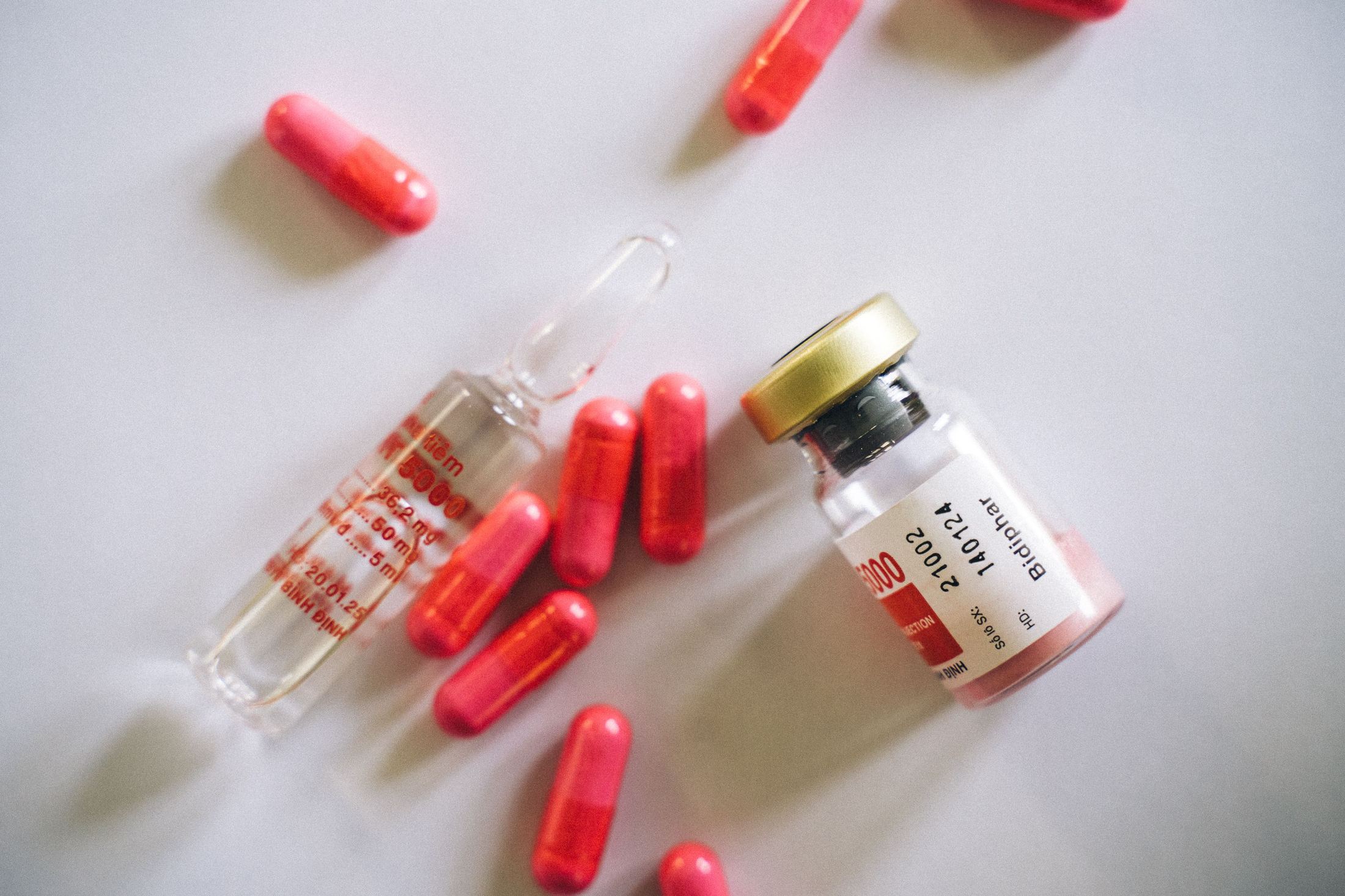Hormone therapy medication vial and capsules